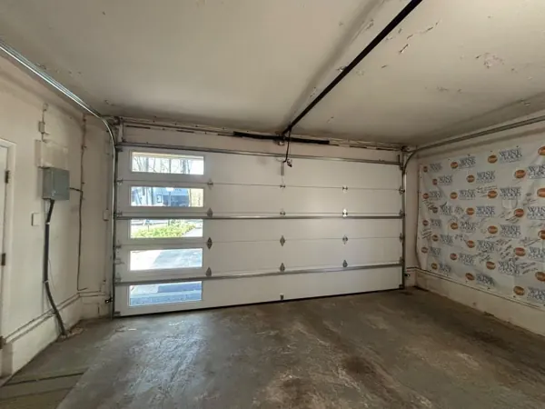 Inside view of a new garage door with vertical glass windows